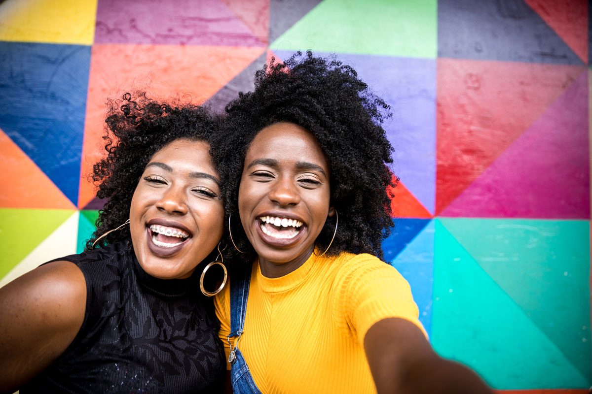 Best Friends Selfie by a Colorful Wall | Motif
