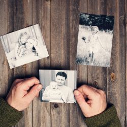 Someone looking at pictures of kids with parents | Motif
