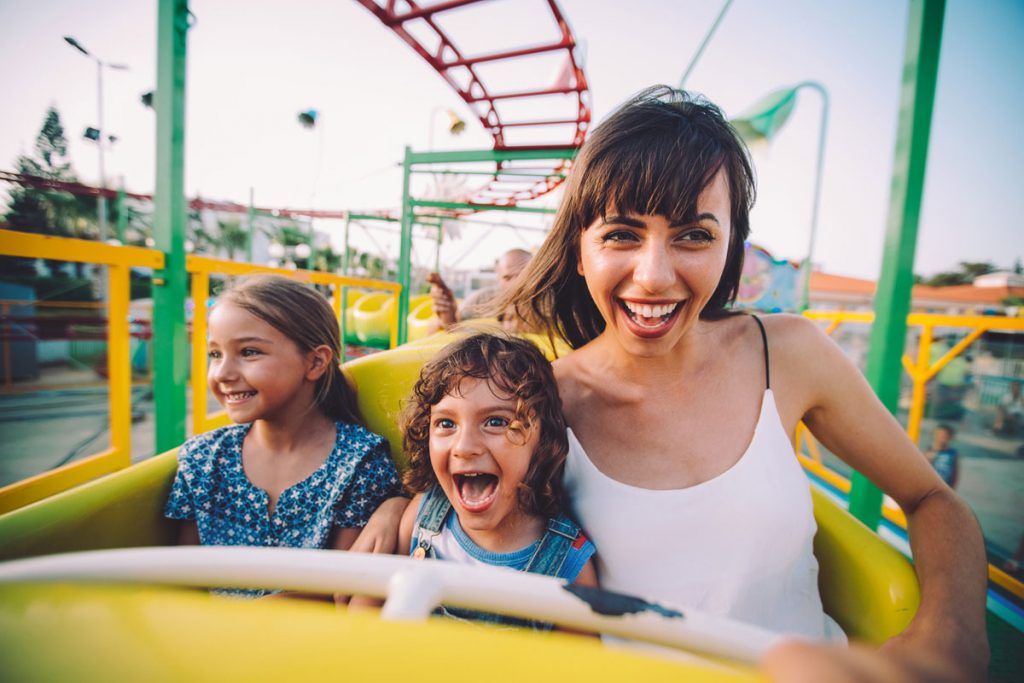 Mother and Kids on a Carnival Ride