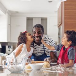 A father baking with his daughter and son | Motif