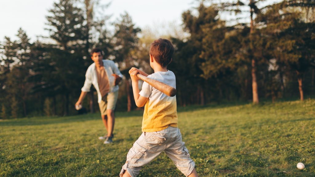 Add photos of Dad playing catch with his son to your Father’s Day photo book.