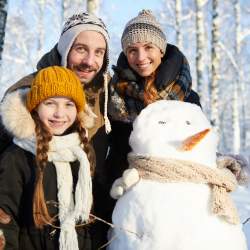 Family Posing with Snowman