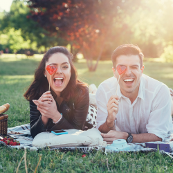 Couple photos can be posed anywhere, like a romantic or silly picnic.