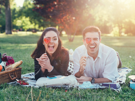 Couple photos can be posed anywhere, like a romantic or silly picnic.