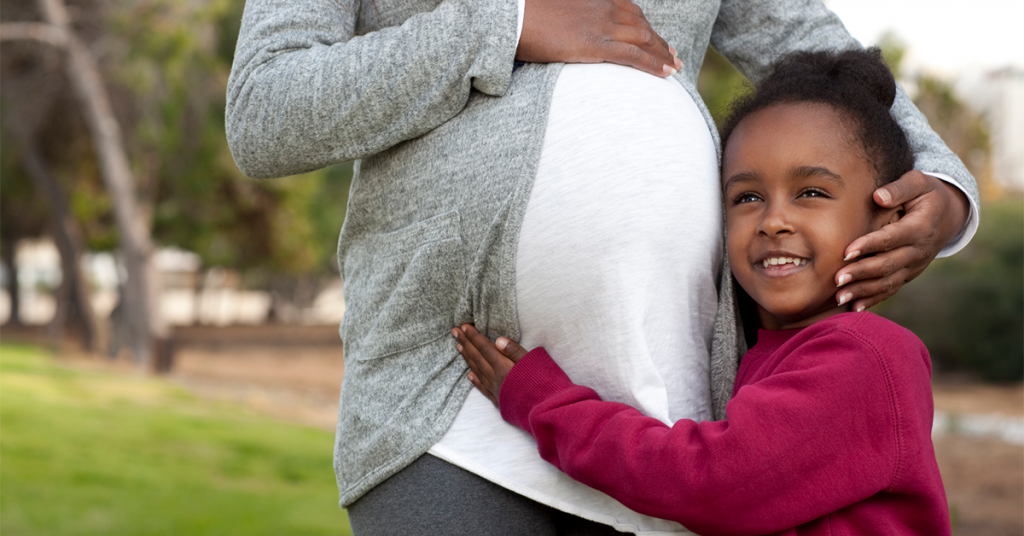 Capture the excitement of becoming a big brother or sister during a family maternity photo shoot.